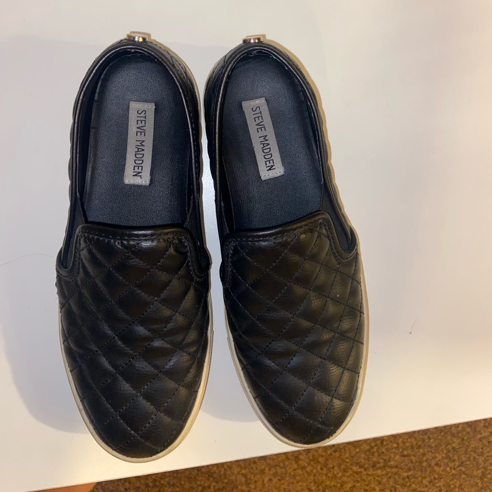 Black quilted Steve Madden slip ons